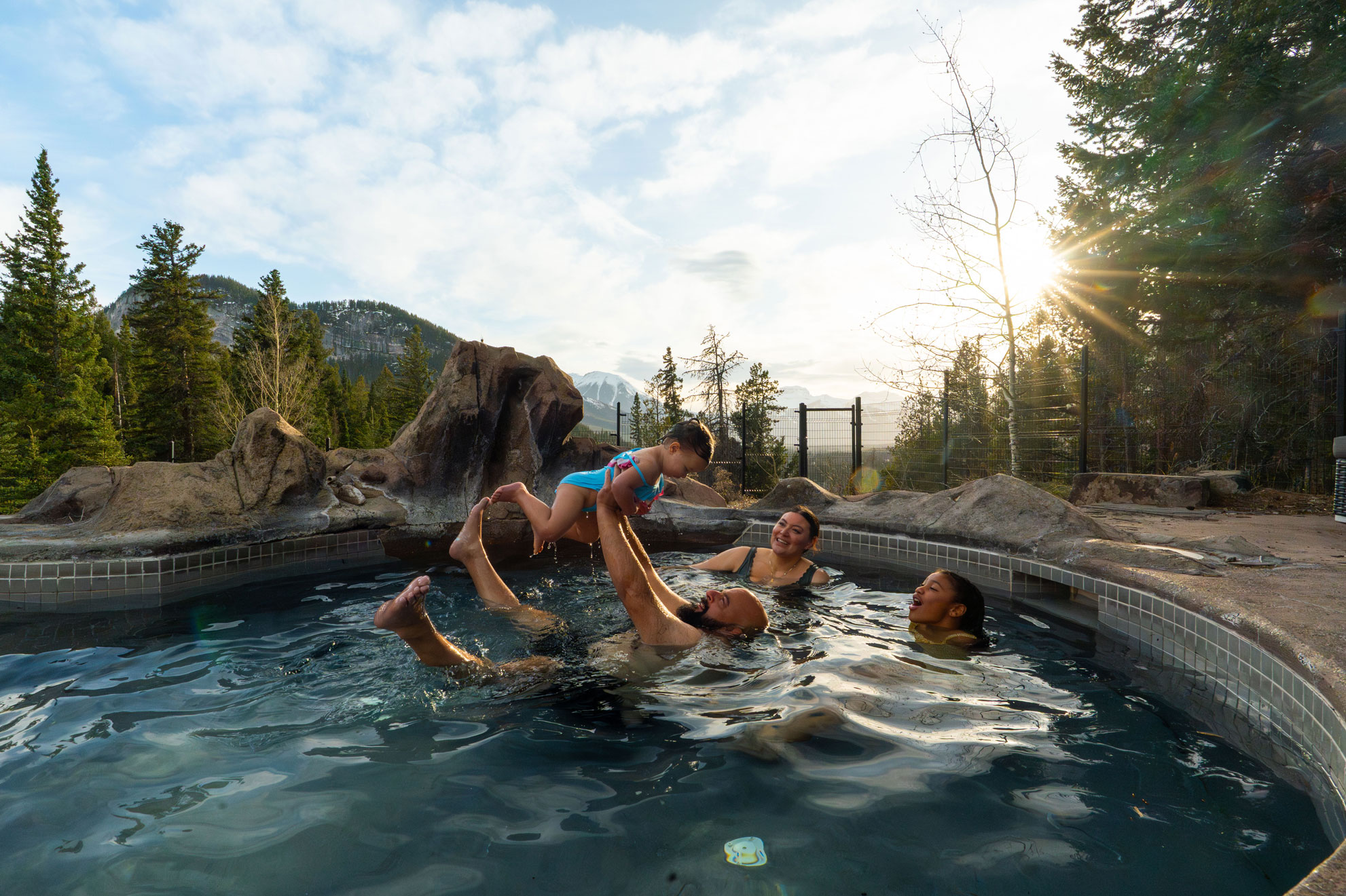 Family enjoying the hot pools at Hidden Ridge Resort