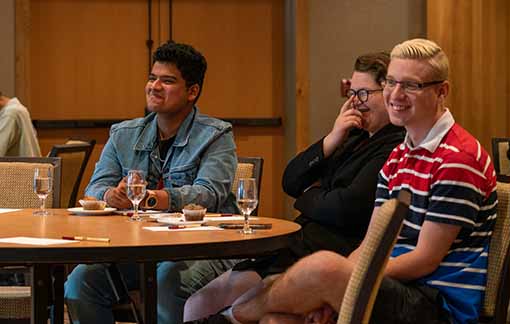 Hospitality students sitting at a table