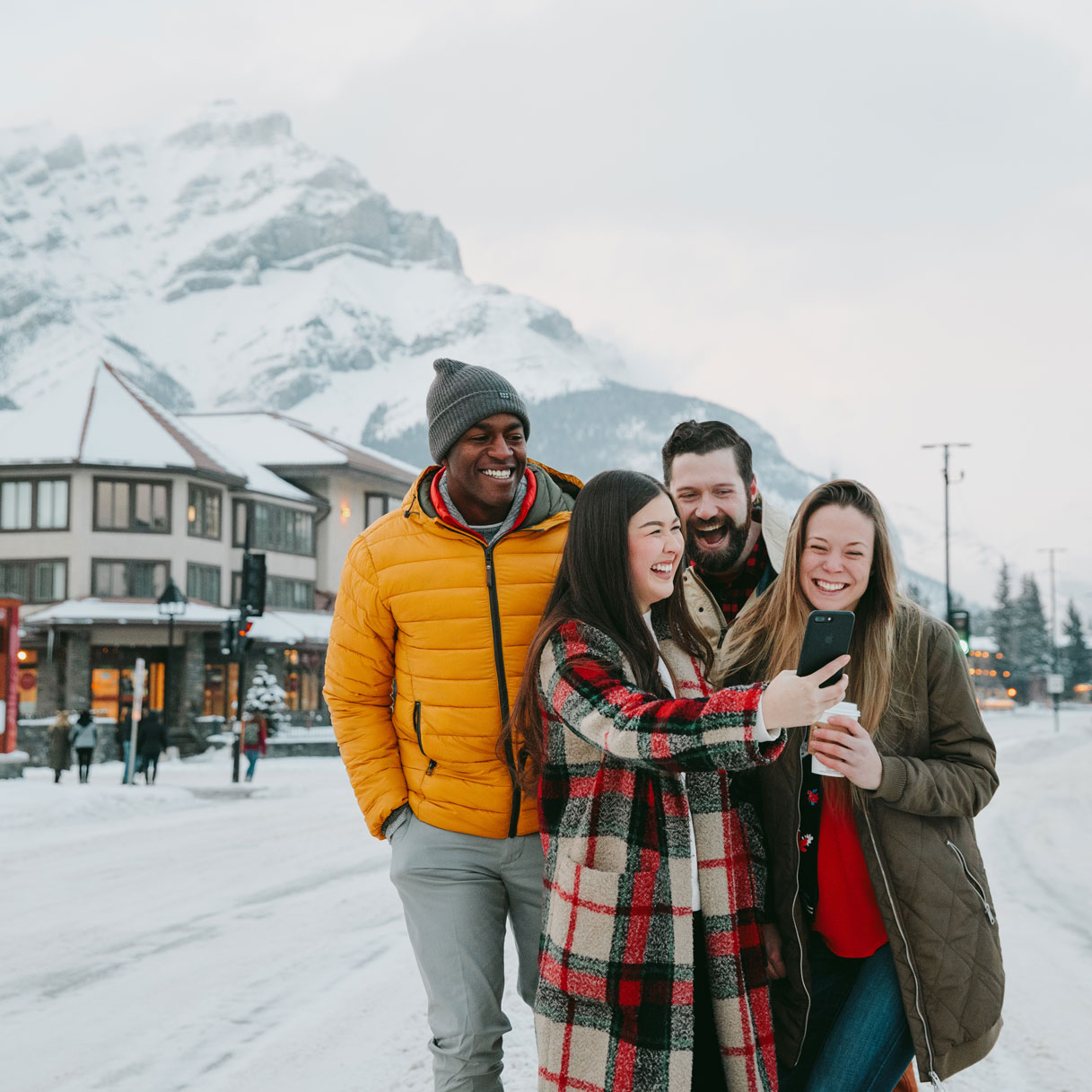 Group of travellers in Banff winter by Erik Atkinson