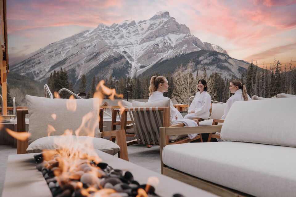 The Otter Hotel's outdoor lounge area with Cascade Mountain in the background