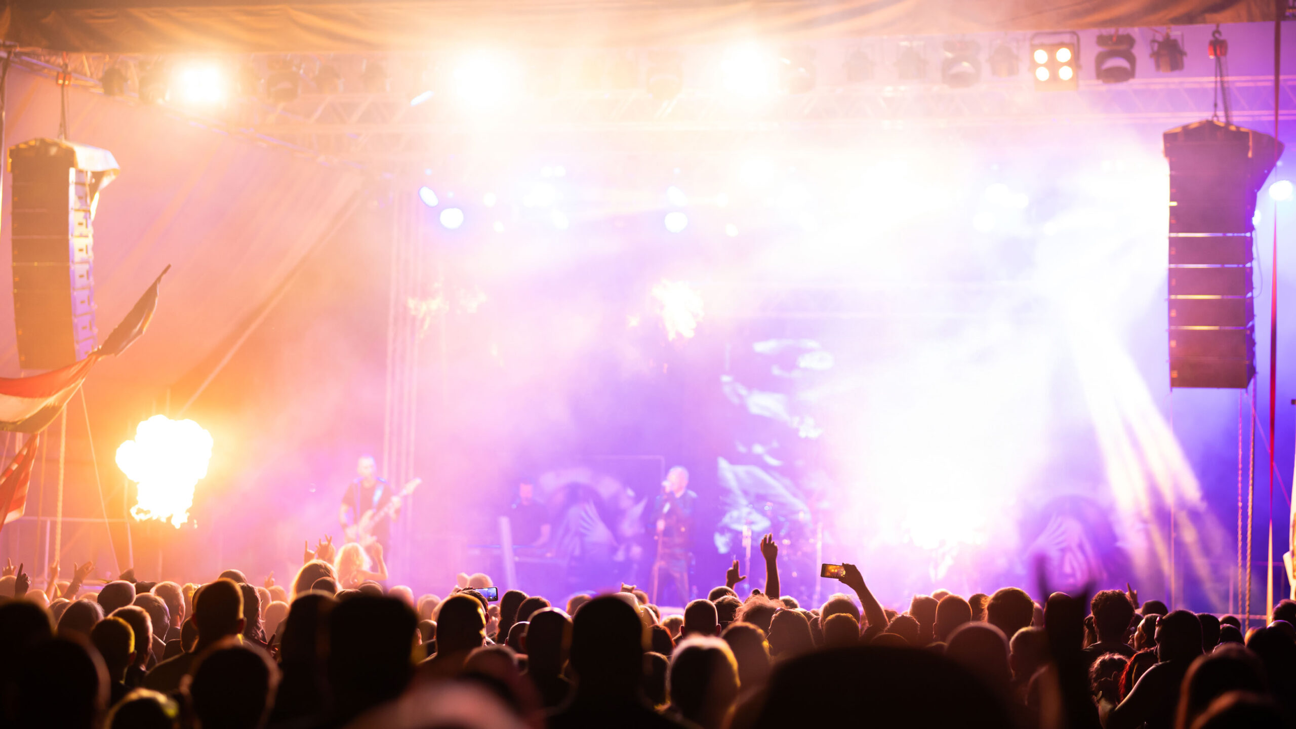 crowd at concert and blurred stage lights